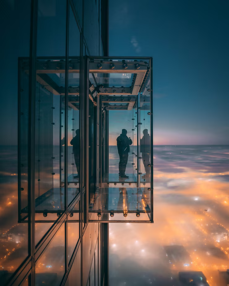 person-enjoying-beautiful-view-city-balcony-with-glass-walls_181624-14671 (1)